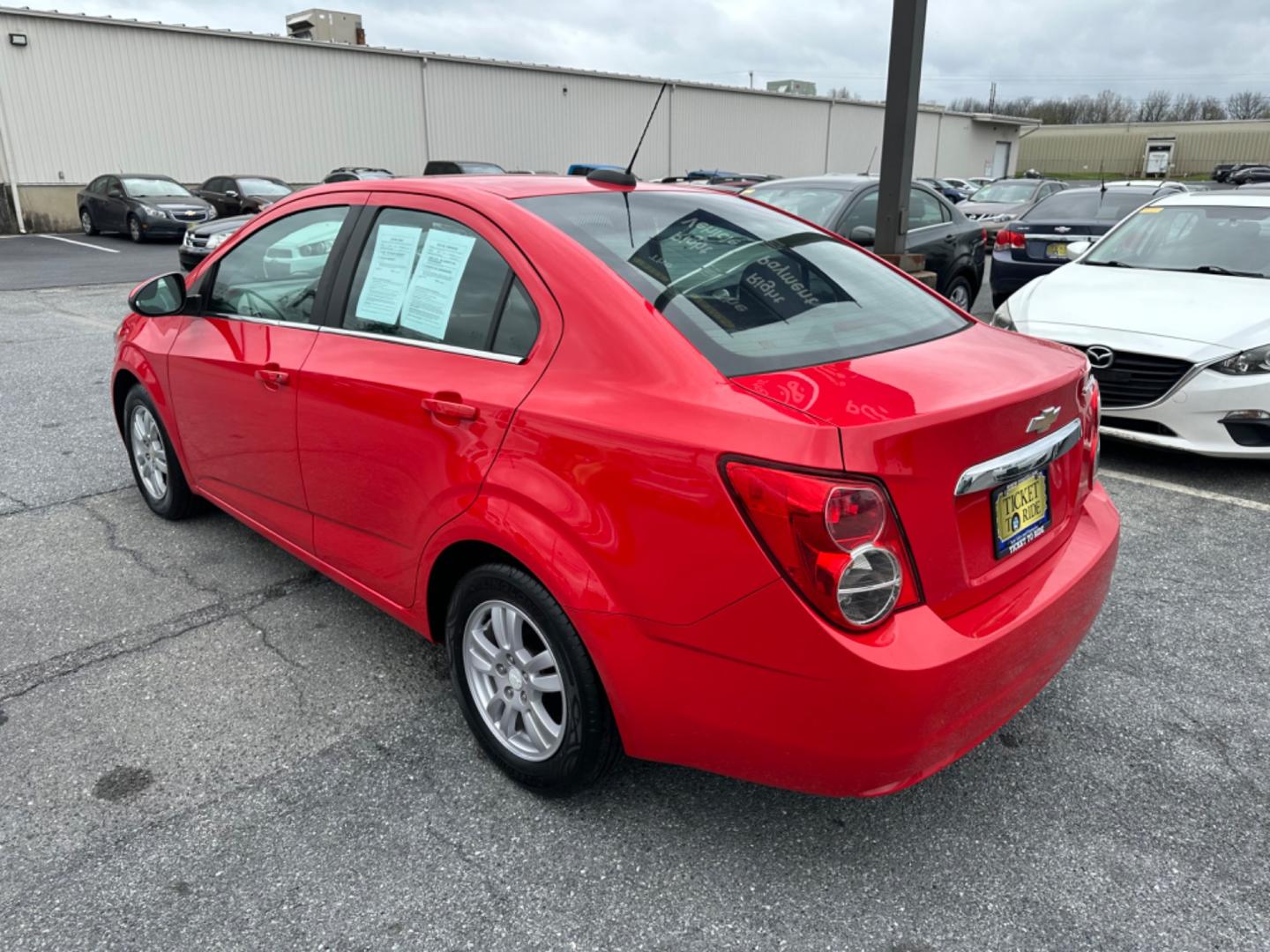 2015 RED Chevrolet Sonic LT Auto Sedan (1G1JC5SH6F4) with an 1.8L L4 DOHC 24V engine, 6-Speed Automatic transmission, located at 1254 Manheim Pike, Lancaster, PA, 17601, (717) 393-9133, 40.062870, -76.323273 - Photo#6